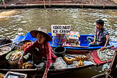 Thailand, Locals sell fruits, food and products at Damnoen Saduak floating market near Bangkok 